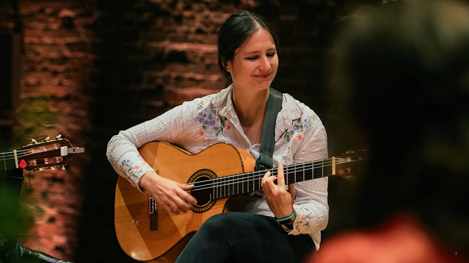 Student applying 7th chords in expressive guitar music